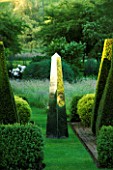 DAVID HARBER SUNDIALS: STAINLESS STEEL MIRRORED OBELISK SUNDIAL ON GRASS PATH WITH YEW TOPIARY AT PETTIFERS GARDEN  OXFORDSHIRE