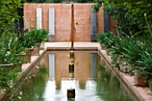LA NORIA  FRANCE. GARDEN DESIGNED BY ARNAUD MAURIERES AND ERIC OSSART - WATER GARDEN - ISLAMIC STYLE GARDEN WITH RILL AND CONCRETE WALL AND SEATS
