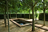 LA NORIA  FRANCE. GARDEN DESIGNED BY ARNAUD MAURIERES AND ERIC OSSART - THE CLOITRE DES MICOCOULIERS - ISLAMIC STYLE WATER GARDEN - WATER BASIN  RILL AND TREES