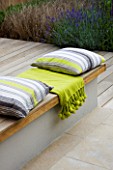 DESIGNER: CHARLOTTE ROWE  LONDON: RAISED DECK WITH CUSHIONS AND THROWS