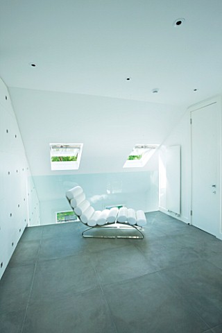 TANIA_LAURIE__LONDON_CONTEMPORARY_WHITE_CHAIR_IN_WHITE_THEMED_BEDROOM
