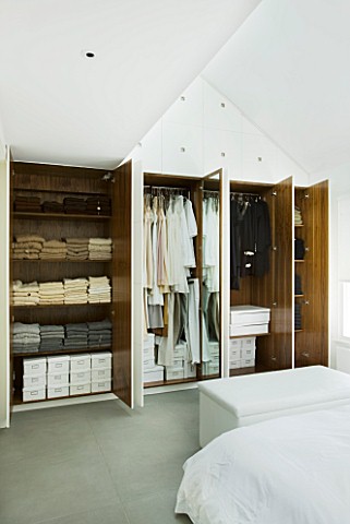 TANIA_LAURIE__LONDON_WARDROBE_SHOWING_TANIAS_LATEST_COLLECTION_OF_CLOTHING_IN_BEDROOM
