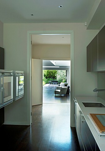 TANIA_LAURIE__LONDON_VIEW_FROM_KITCHEN_LEADING_THROUGH_TO_LIVING_AREA_WITH_COURTYARD_GARDEN_JUST_VIS