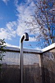 CONTEMPORARY FORMAL ROOF TERRACE/ GARDEN DESIGNED BY DATA NATURE ASSOCIATES: MODERN METAL SHOWER LIT AT NIGHT WITH METAL BEAD SCREEN