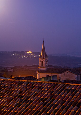 PROVENCE__FRANCE_BONNIEUX_CHURCH_IN_M_OONLIGHT_WITH_LACOSTE_BEYOND