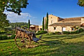 PROVENCE  FRANCE: DOMAINE DE LA VERRIERE: VIEW OF THE PROPERTY WITH A CARRIAGE IN THE FOREGROUND