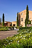 PROVENCE  FRANCE: DOMAINE DE LA VERRIERE: VIEW OF THE PROPERTY WITH THE WHITE GARDEN IN THE FOREGROUND