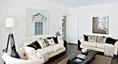 CHRISTMAS - LIVING ROOM WITH CREAM SOFAS  CUSHIONS AND TRIPOD LAMP. SARAH EASTEL LOCATIONS/ DI ABLEWHITE