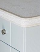 DESIGNER: CLAIRE SKINNER  ROU ESTATE  CORFU: KITCHEN - DETAIL OF SIDEBOARD TOP AND DRAWER WITH METAL KNOB