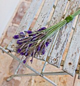 PRIVATE VILLA  CORFU  GREECE. DESIGN BY ALITHEA JOHNS - HAND-TIED LAVENDER ARRANGEMENT ON OLD CHAIR