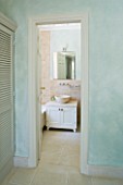PRIVATE VILLA  CORFU  GREECE. GREEN BEDROOM WITH VIEW INTO EN SUITE BATHROOM