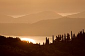 THE ROU ESTATE  CORFU: DAWN LIGHT ON CORFU HILLS AND ALBANIAN MOUNTAINS BEYOND