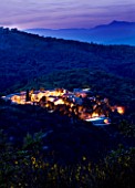 THE ROU ESTATE  CORFU: THE ROU ESTATE AT NIGHT WITH LIGHTING - ALBANIAN MOUNTAINS BEYOND