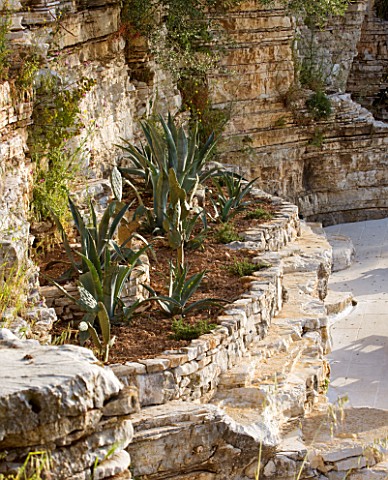 THE_ROU_ESTATE__CORFU_ROCK_FACE_BESIDE_THE_POOL_WITH_AGAVES