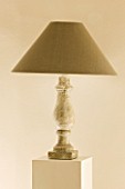 THE ROU ESTATE  CORFU: INTERIOR DETAIL OF TABLE LAMP ON STONE PLINTH