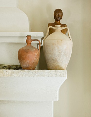 THE_ROU_ESTATE__CORFU_INTERIOR_DETAIL_OF_STONE_AND_EARTHERNWARE_JUGS_ON_FIREPLACE