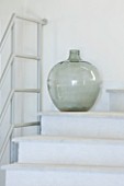 THE KAPARELLI ESTATE  CORFU - DECORATIVE GLASS BOTTLE ON STAIRS