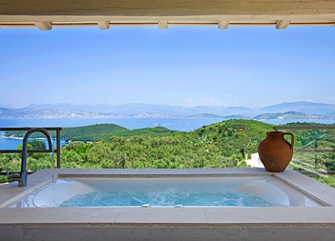 THE_KAPARELLI_ESTATE__CORFU__UNDERCOVER_JACUZZIHOT_TUB_ON_RAISED_PATIO_WITH_VIEW_OUT_TO_SEA_WITH_ALB