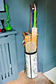 JOA STUDHOLMES LONDON HOME: LANDING WITH UMBRELLA STAND CONTAINING SPORTS EQUIPMENT