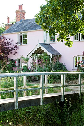 PAULA_PRYKES_HOUSE__SUFFOLK_VIEW_TO_HOUSE_WITH_BRIDGE