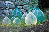 JACQUELINE MORABITO  FRANCE: GLASS JARS AS SCULPTURE BENEATH OLIVE TREE