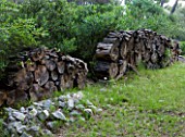 JACQUELINE MORABITO  FRANCE - HUGE LOGS PILED TOGETHER AS A WALL SCULPTURE