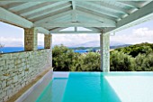 PRIVATE VILLA  CORFU  GREECE. DESIGN BY ALITHEA JOHNS - COVERED SWIMMING POOL WITH VIEW OUT TO ALBANIA