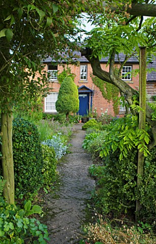 MOORS_MEADOW_GARDEN__NURSERY__HEREFORDSHIRE_PATH_THROUGH_THE_VEGETABLE_GARDEN_LEADING_TO_THE_FRONT_D