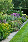 MEADOW FARM  WORCESTERSHIRE: THE LONG BORDER - SOUTH SIDE WITH PURPLE/YELLOW THEMED PERENNIAL PLANTING
