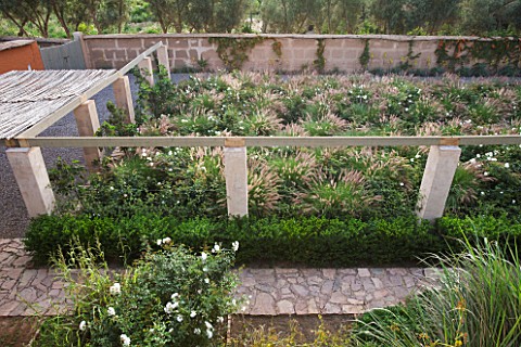DESIGNERS_ERIC_OSSART_AND_ARNAUD_MAURIERES__MOROCCO_AL_HOSSOUN__THE_ENTRANCE_COURTYARD_PLANTED_WITH_