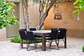 DESIGNERS ERIC OSSART AND ARNAUD MAURIERES  MOROCCO: AL HOSSOUN -  A PLACE TO SIT: TABLE AND CHAIRS ON TERRACE/ PATIO/COURTYARD