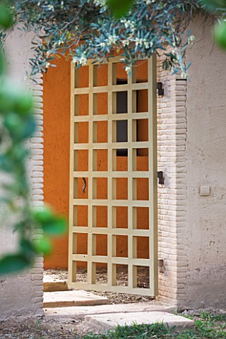 DESIGNERS_ERIC_OSSART_AND_ARNAUD_MAURIERES__MOROCCO_AL_HOSSOUN__WOODEN_DOOR_IN_WALL
