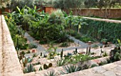 DESIGNERS ERIC OSSART AND ARNAUD MAURIERES  MOROCCO: AL HOSSOUN - THE SUNKEN GARDEN PLANTED WITH SUCCULENTS