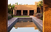 DESIGNERS ERIC OSSART AND ARNAUD MAURIERES  MOROCCO: DAR IGDAD - SWIMMING POOL AND RAMMED EARTH BUILDING