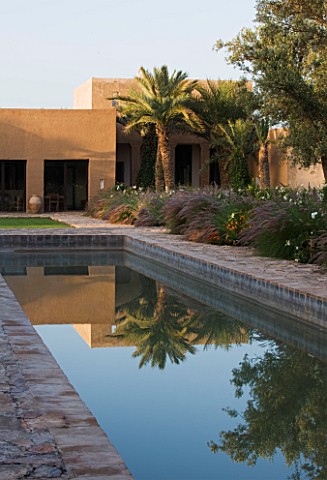 DESIGNERS_ERIC_OSSART_AND_ARNAUD_MAURIERES__MOROCCO_DAR_IGDAD_GARDEN__SWIMMING_POOL_AND_RAMMED_EARTH