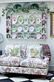 DESIGNER BUTTER WAKEFIELD  LONDON: CONSERVATORY WITH SHELVES DISPLAYING PLATES AND SETTEE