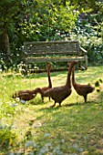 DESIGNER ALISON HENRY - PRIVATE GARDEN, COTSWOLDS: MEADOW AND GRASS PATH WITH WILLOW GEESE SCULPTURE BY RUPERT TILL - ORNAMENT, ENGLISH GARDEN, CLASSIC, COUNTRY