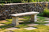 DESIGNER ALISON HENRY - PRIVATE GARDEN, COTSWOLDS: STONE SEAT / BENCH BY STONE WALL WITH CHEQUERBOARD GRASS SQUARES - ENGLISH GARDEN, CLASSIC, COUNTRY