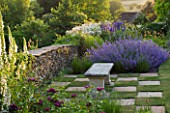 DESIGNER ALISON HENRY - PRIVATE GARDEN, COTSWOLDS: STONE SEAT / BENCH BY STONE WALL WITH CHEQUERBOARD GRASS SQUARES AND NEPETA - ENGLISH GARDEN, CLASSIC, COUNTRY