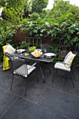 DESIGNER CHARLOTTE ROWE LONDON: SMALL, TOWN, CITY, FORMAL, CONTEMPORARY, GARDEN, PAVING, TERRACE, PATIO, FENCES, FENCING, SCREENS, WOODEN, BLACK, TABLE, CHAIRS, CUSHIONS, ENTERTAINING