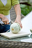 DESIGNER CLARE MATTHEWS: CLARE CUTS UP  A SWEETHEART MELON IN HER CONSERVATORY