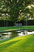 WHATLEY MANOR  WILTSHIRE: THE LOGGIA GARDEN WITH LAWN  POOL AND WATER FEATURE BY SIMON ALLISON