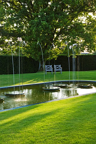 WHATLEY_MANOR__WILTSHIRE_THE_LOGGIA_GARDEN_WITH_LAWN__POOL_AND_WATER_FEATURE_BY_SIMON_ALLISON