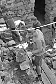 DIGNE LES BAINS  FRANCE: BLACK AND WHITE IMAGE STONE MASONS WORKING FOR ANDY GOLDSWORTHY
