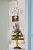 VILLA GIUSEPPINA  LAKE COMO  ITALY - THE ENTRANCE HALL WITH BOUQUET OF FLOWERS AND CANDELABRA