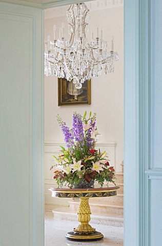 VILLA_GIUSEPPINA__LAKE_COMO__ITALY__THE_ENTRANCE_HALL_WITH_BOUQUET_OF_FLOWERS_AND_CANDELABRA