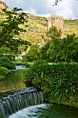 NINFA GARDEN, GIARDINI DI NINFA, ITALY: STREAM THROUGH GARDEN WITH WATERFALL AND STONE TOWER. ROMANTIC, STREAM, RIVER, FLOW, FLOWING, MOVEMENT, WALLS, OLD BUILDING, ROMANTIC