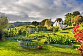 DESIGNER CLARE MATTHEWS: THE FRUIT AND VEGETABLE GARDEN IN DEVON. RAISED  BLUE PAINTED WOODEN BEDS AND ARBOUR  BLUE PAINTED METAL BENCH AND HOUSE