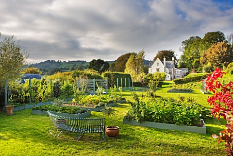 DESIGNER_CLARE_MATTHEWS_THE_FRUIT_AND_VEGETABLE_GARDEN_IN_DEVON_RAISED__BLUE_PAINTED_WOODEN_BEDS_AND