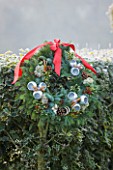 HIGHFIELD HOLLIES  HAMPSHIRE. WREATH BY SEASONSFLOWERS.CO.UK IN HOLLY HEDGE (ILEX) FROST  WINTER